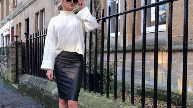 GIrl in leather skirt and chunky sweater