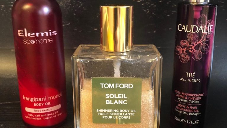 three body oils on black backdrop