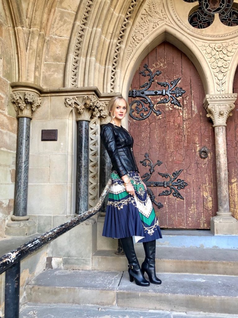 Pleated skirt with leather jacket