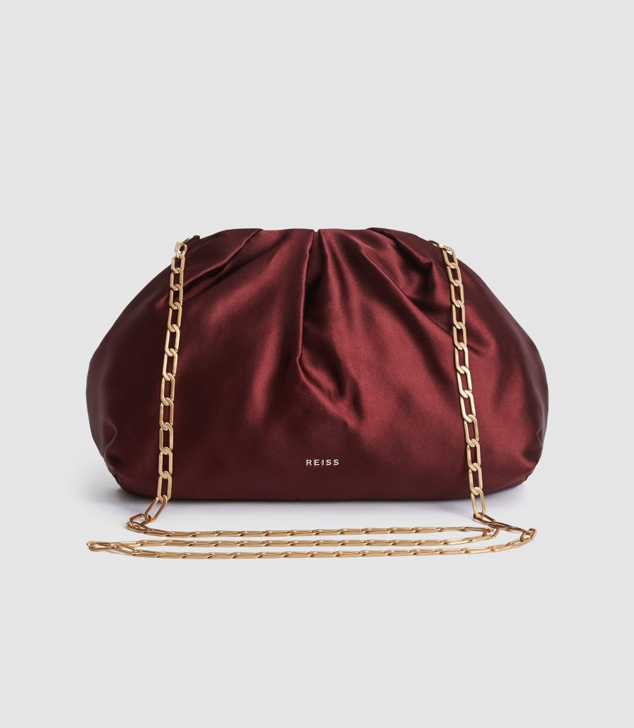 Red satin clutch bag with chain strap