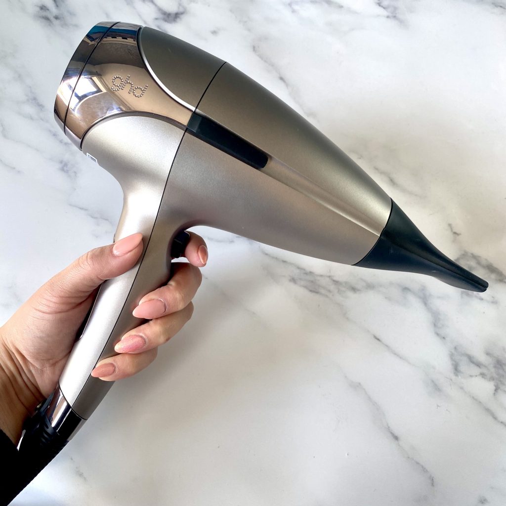 GHD Helios in Warm Pewter on marble background