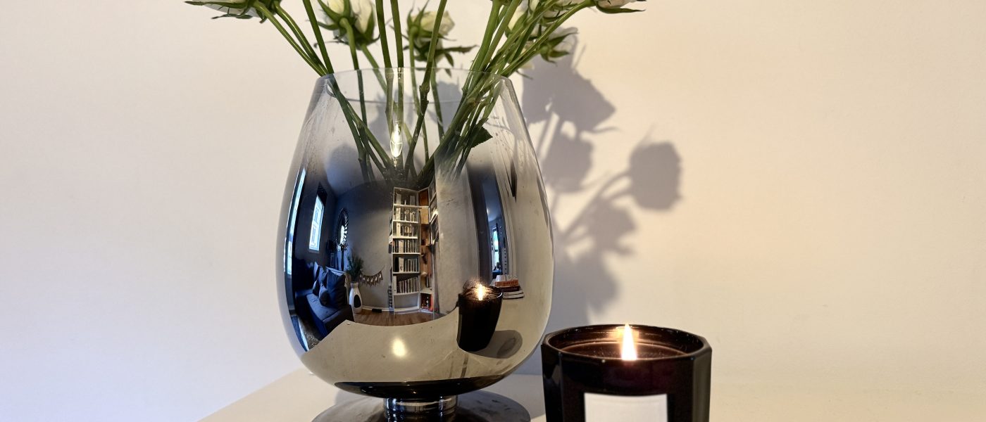 white roses with celine candle to romanticise your spring