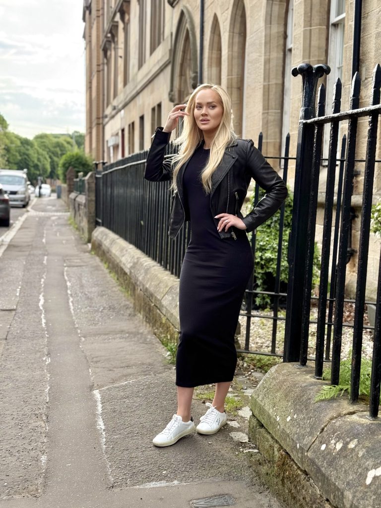Girl in black maxi dress and leather jacket