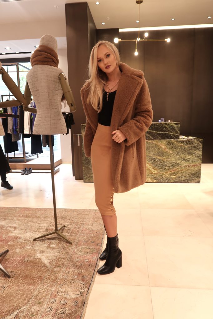  girl wears camel teddy coat 