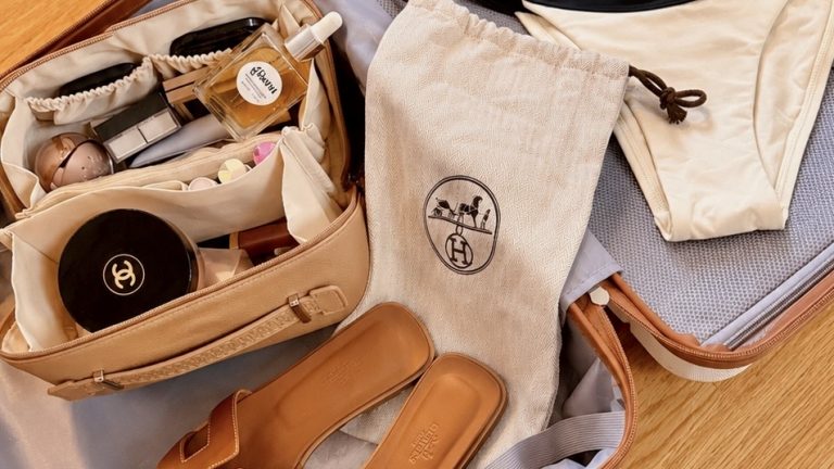 elegant suitcase with Hermes Orans, Chanel and a bikini