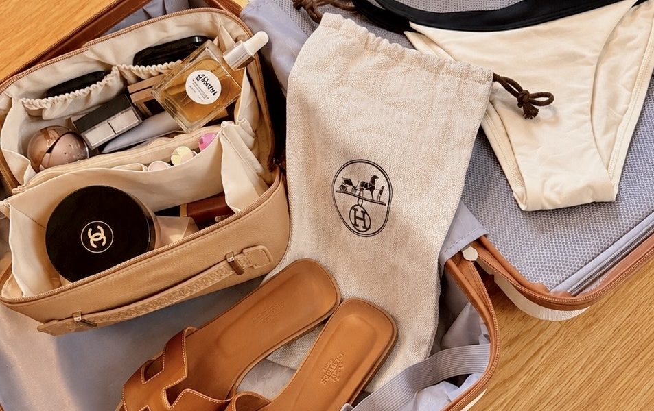 elegant suitcase with Hermes Orans, Chanel and a bikini
